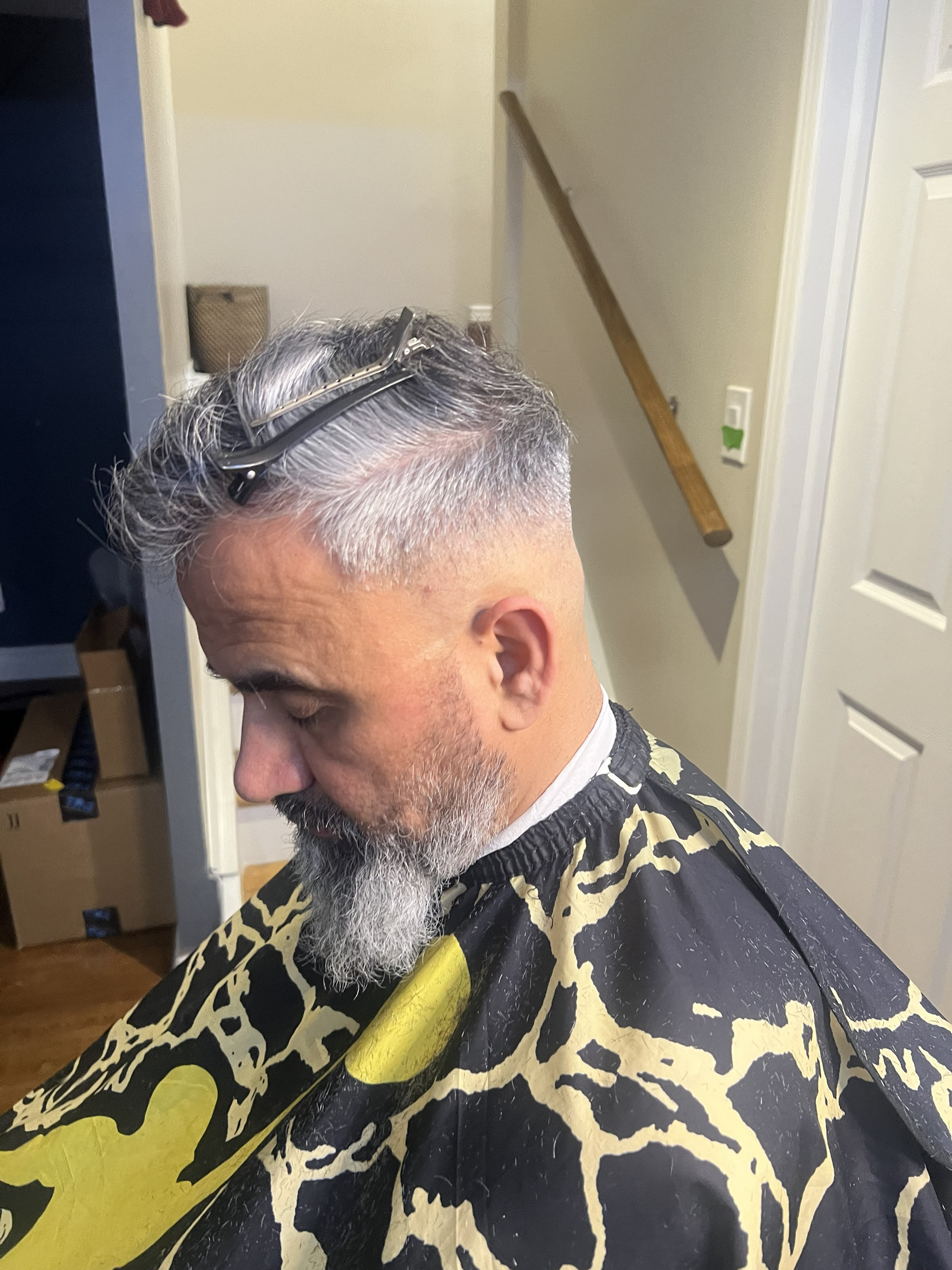 Grey fade with textured top and full beard