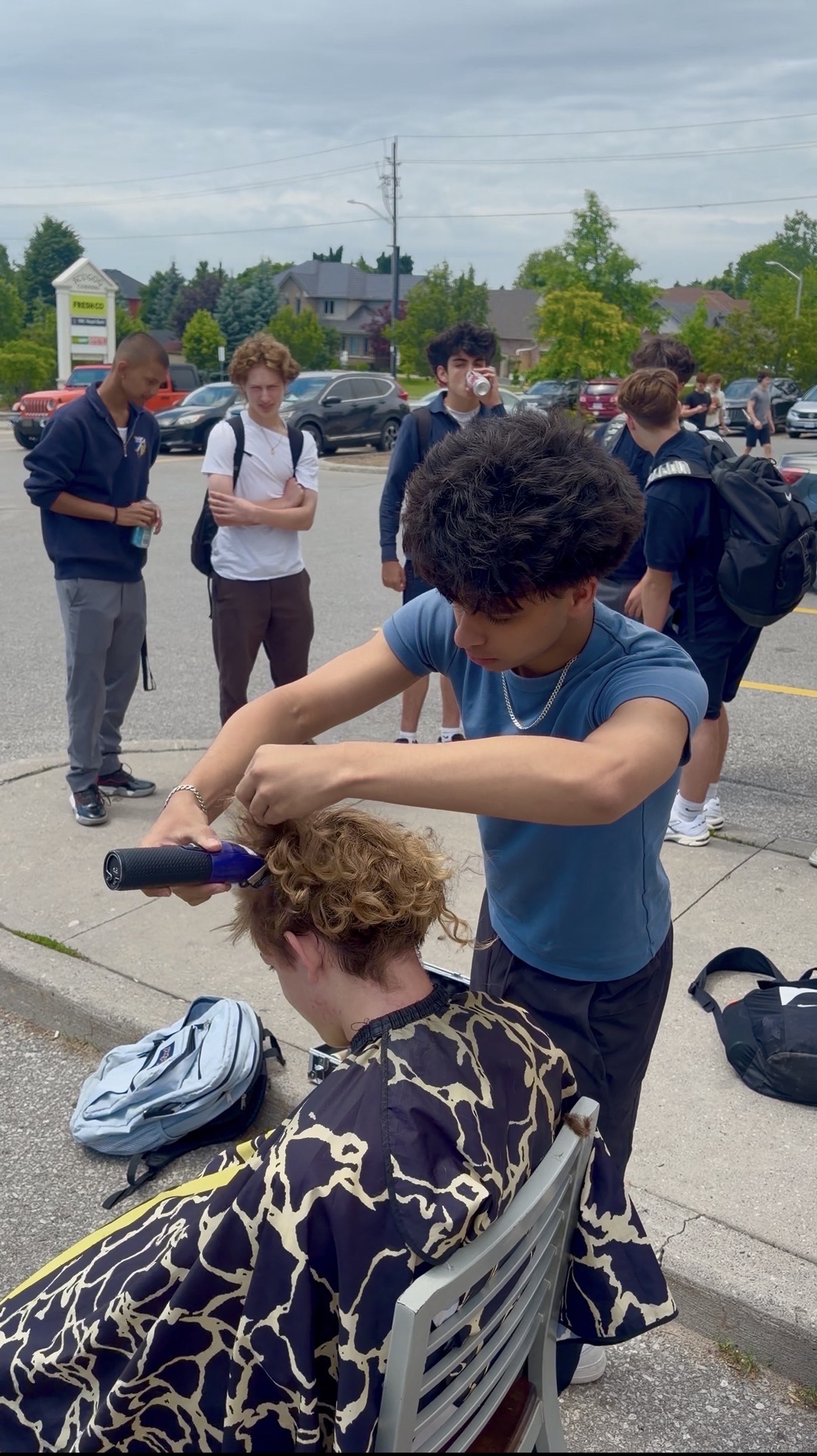 Cutting curly hair on location